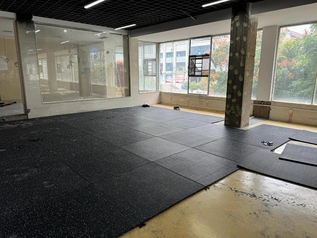 Setting out and cutting rubber flooring during installation