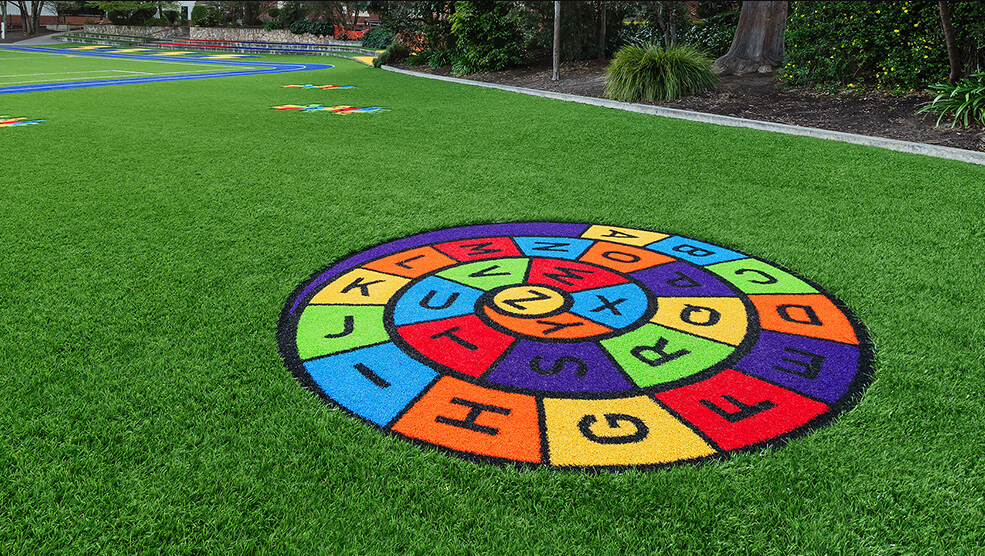 Custom play and activity patterns designed into artificial turf