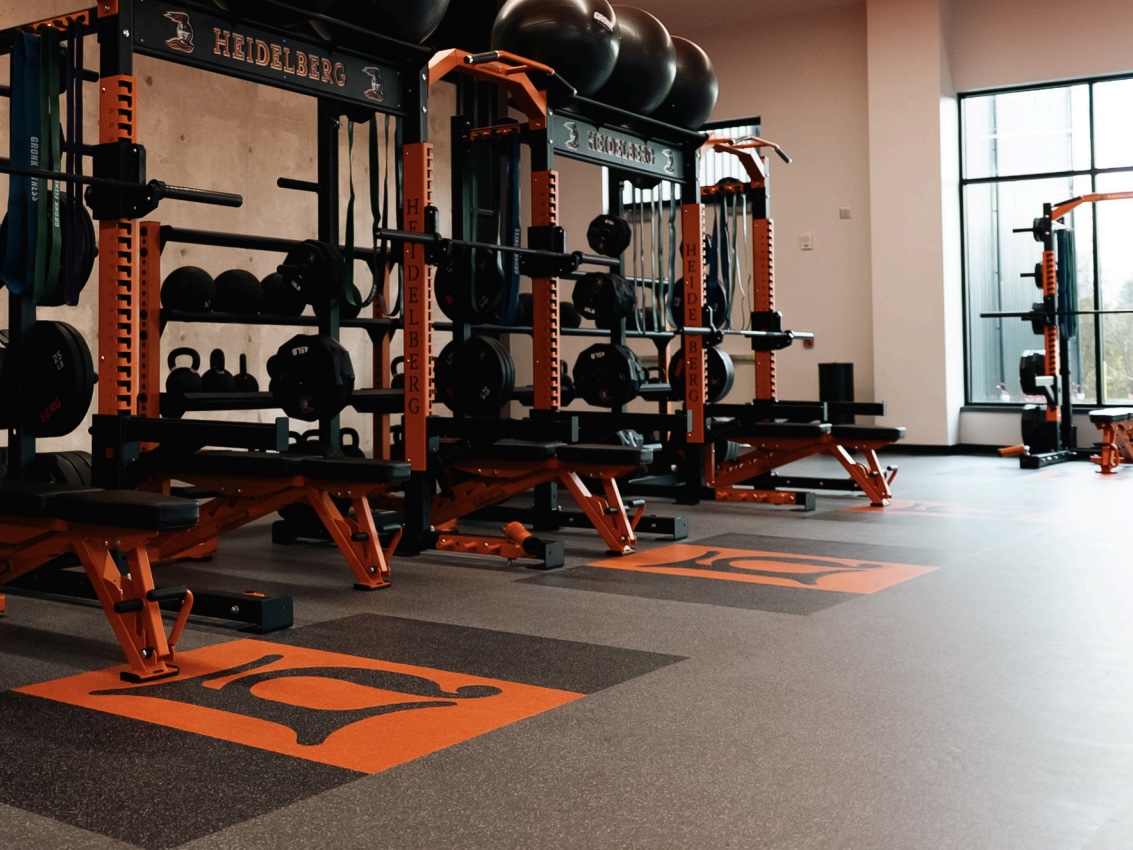 Heidelberg University gym flooring with custom colors and branded graphics
