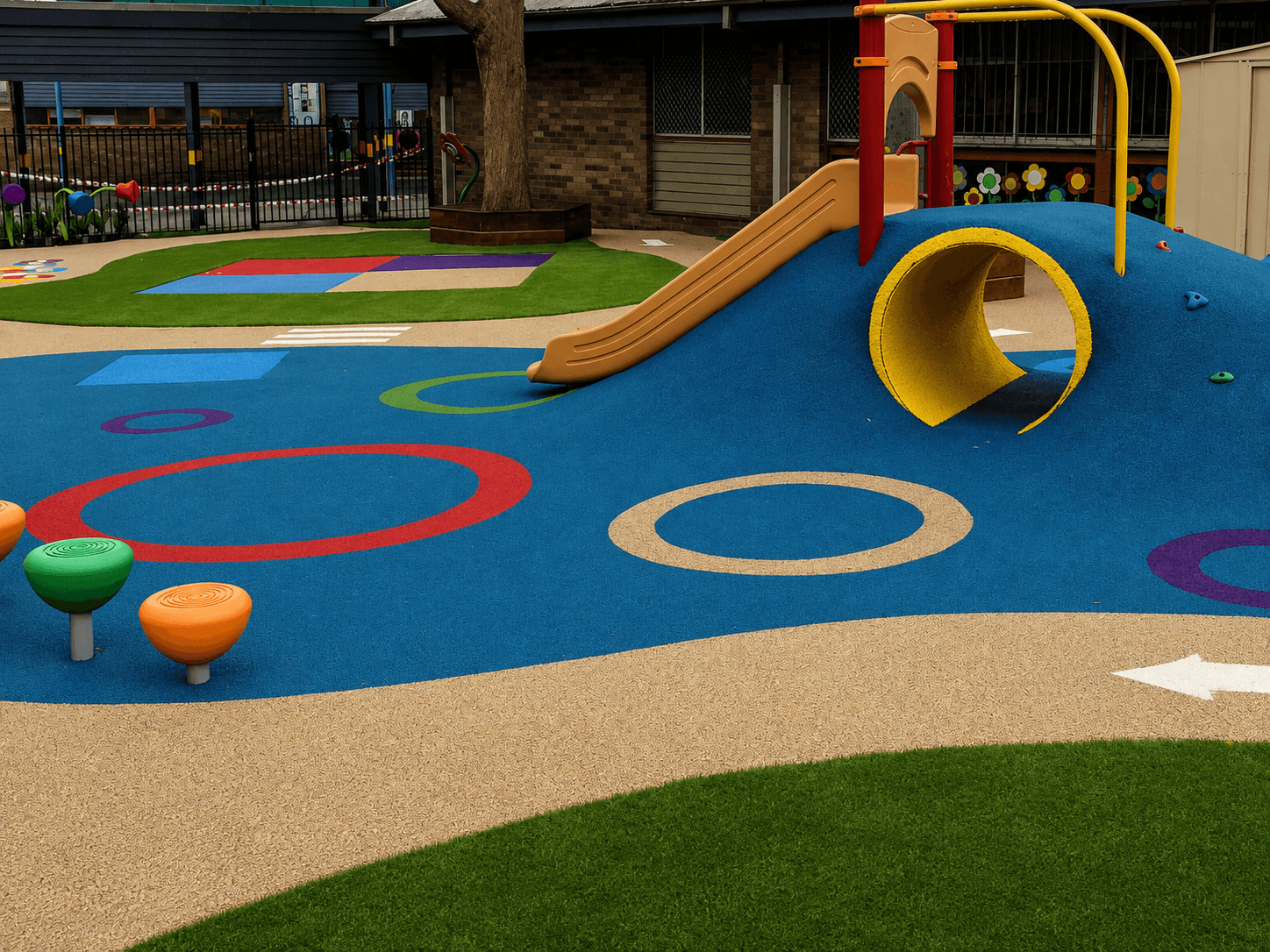 Playground flooring designed around school and project identity