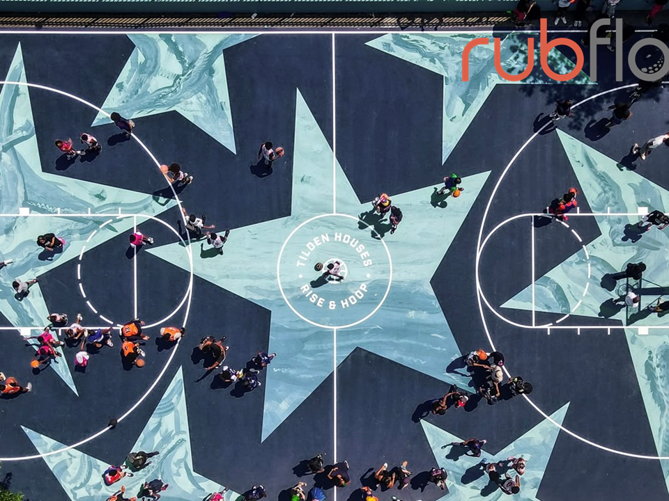 Custom logos lettering and graphics integrated into a Silicon PU sports court by Rubflo