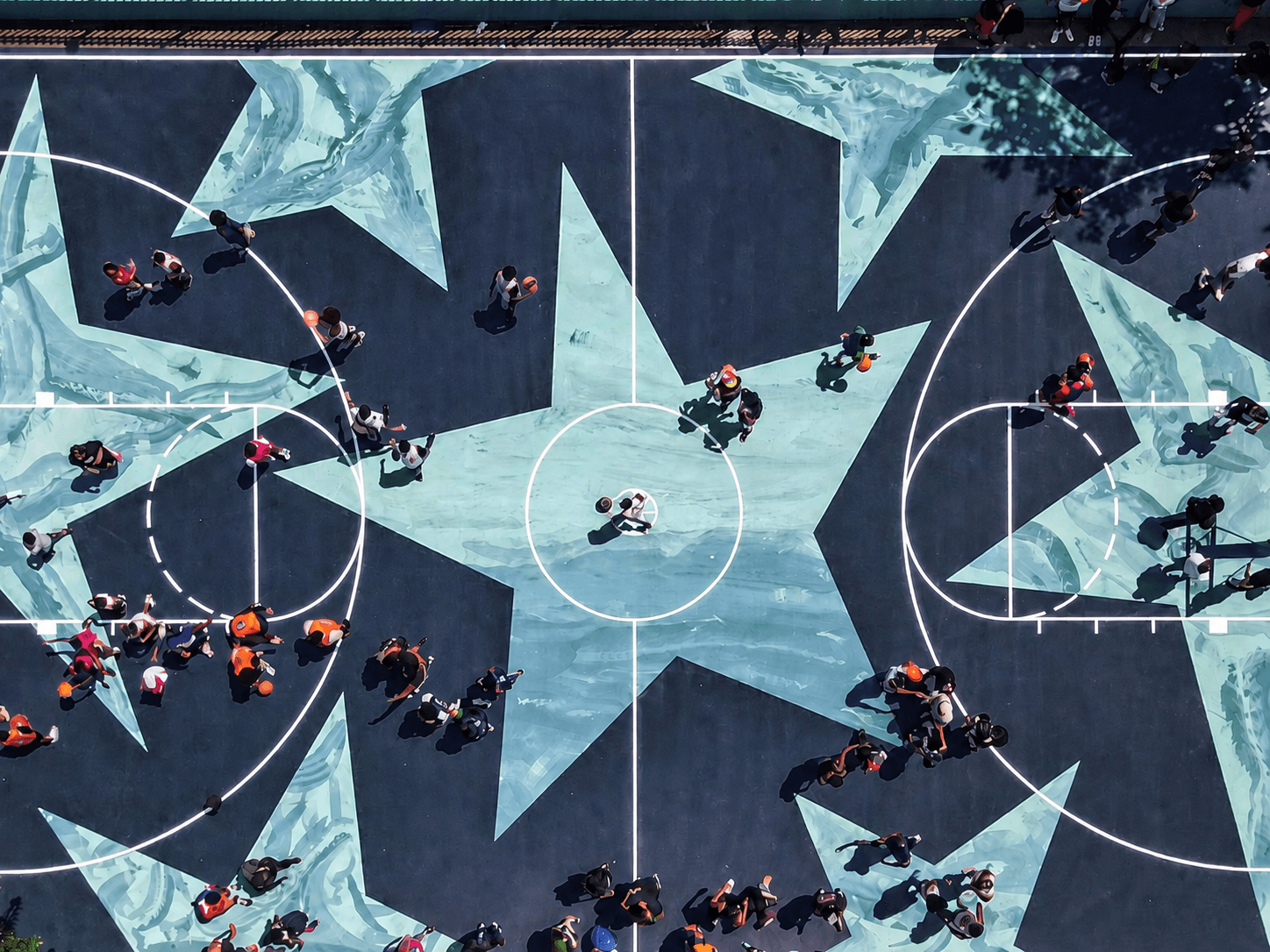 Custom logos lettering and graphics integrated into a Silicon PU sports court by Rubflo