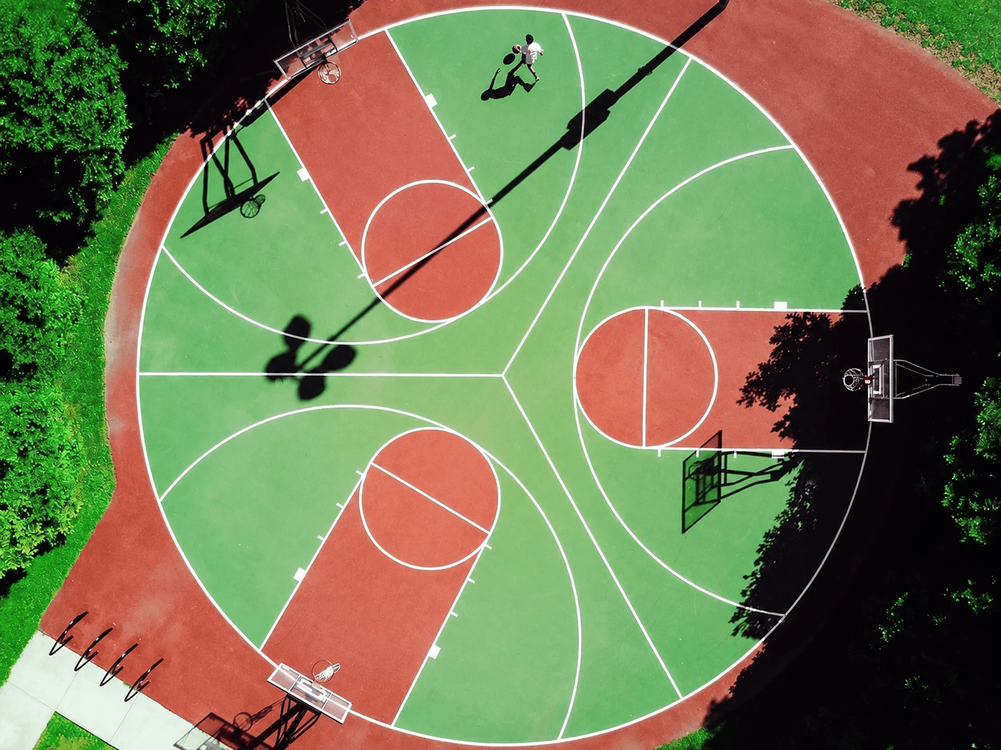 Customized Silicon PU sports court with geometric court layout by Rubflo